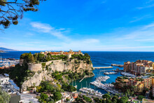 View of the Rock of Monaco (French: Le Rocher) and parts of Monte Carlo and Fontvielle harbors at the Mediterranean waterfront. Monaco-Ville, Monaco. 