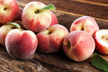 Wall Mural - A group of ripe peaches on wooden table