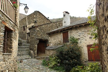 Evol, a picturesque village in Pyrenees-Orientales Department, southern France featuring houses built of schist with thackstone roofs 