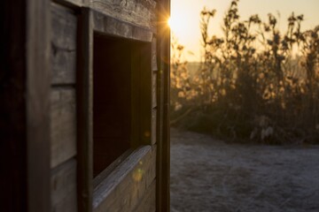 Sticker - Closeup shot of a wooden country house during a sunset