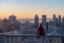 Montreal, Canada - May 2020 : Back View Of A Young Man Wearing A Lumberjack Shirt, Admiring The Sunrise From The Kondiaronk Belvedere  