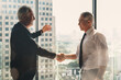 © Mongkolchon - businessman handshake for teamwork of business merger and acquisition