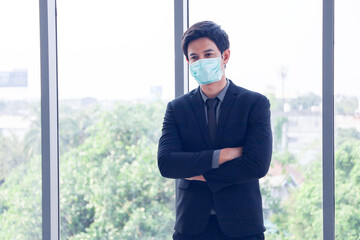 Business officer wear mask in office and posing portrait for protect covid 19 or corona virus or symptom of disease