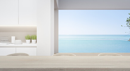 Wall Mural - Dining room near modern kitchen in luxury beach house. Home interior 3d rendering with empty wooden top table and sea view for product display.