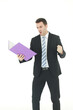 © cocorattanakorn - Handsome Caucasian man in black suit holding violet document file and serious in work isolated on white background.