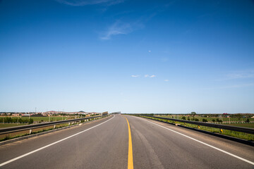 Picturesque country road and clear sky