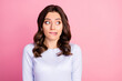 Photo of attractive lady wavy hairdo biting lips look shy side empty space made wrong bad thing uncomfortable situation wear casual white pullover isolated pink color background
