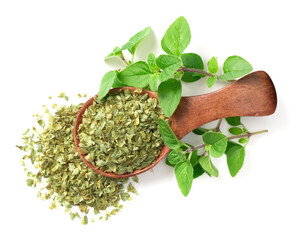 Wall Mural - dried oregano flakes in the wooden spoon, with fresh oregano twigs, isolated on white background, top view