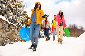 Wall Mural - Group of friends outdoors on snowy day. Winter vacation