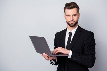 Wall Mural - Portrait of confident successful entrepreneur man use laptop work on start-up project chat with clients partners wear formalwear clothing isolated over grey color background