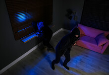 Dangerous Criminals In Masks With Weapon Robbing House, Above View