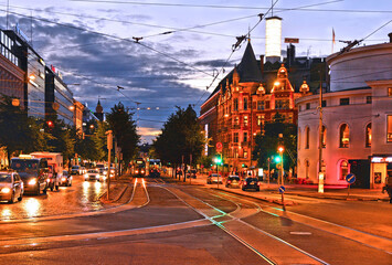 Wall Mural - .helsinki night with classic old colorful buildings, street traffic, people walking an blue hour sky, finland