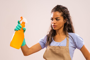 Wall Mural - Portrait of african-american housewife who doesn't like cleaning.