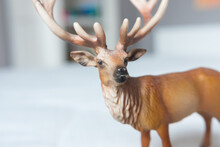 Beautiful Standing Up Reindeer/stag Miniature Toy Made Of Rubber Or Plastic. Perfect Animal Toy For Children To Play With. Blurred Background. 