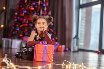 Portrait of a preschool child girl laying down. Studio shot.