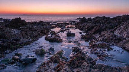 Wall Mural - Sunrise over the sea in Guernsey.