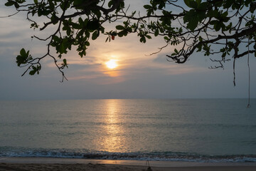 Wall Mural - beautiful sunset or sunrise on na dan beach, khanom, nakhon si thammarat thailand. beautiful golden 