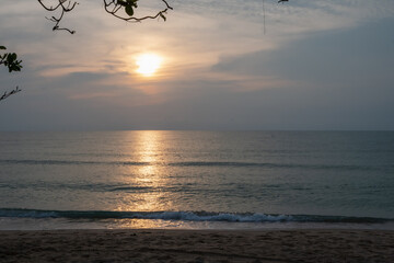 Wall Mural - beautiful sunset or sunrise on na dan beach, khanom, nakhon si thammarat thailand. beautiful golden 