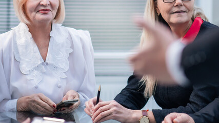 Canvas Print - qualified professionals listening to the report at the meeting in the office