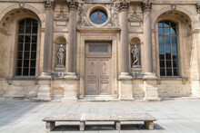 Antique Inlaid Wooden Door With Carved Stone Structure In An Ancient Palace In Paris.