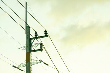 Electricity power transmission line on sunrise with copy space, Electricity pylon on orange sky