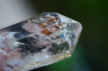 Wall Mural - High Quality Clear Quartz with Hematite inclusions. Healing stone with Unique formations, Quartz Scepter with Hematite. Witches Crystal healing crystals, macro photo bright natural lighting. 