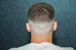sport young man with a modern trendy fadeback haircut for barbershop