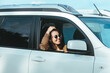 © phpetrunina14 - woman in white suv car at sea beach. bay on background