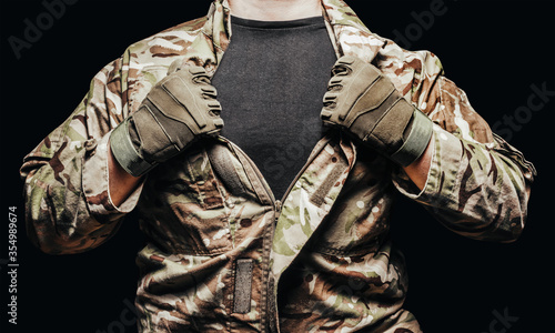 Cuadros en Lienzo Soldier in camouflaged tunic, torso view with shirt.