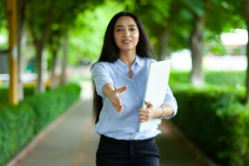 Wall Mural - happy woman  greet by hand in street