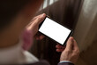 © Ильсур Маликов - a man holds a phone with a white screen photo above