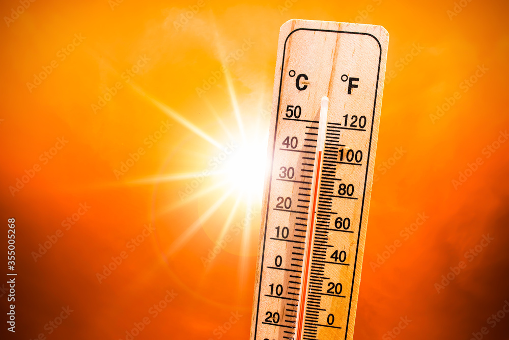 Background for a hot summer or heat wave, orange sky with with bright sun and thermometer - obrazy, fototapety, plakaty 