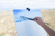 © Marc Romanelli - senior woman artist painting landscape, White Rock, New Mexico