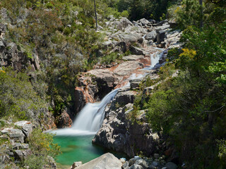 Waterfall and lake of portela do homem in Portugal on a spring sunny afernoon.