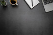 © otello-stpdc - Workspace in office with black table. Top view from above of laptop with notepad and coffee. Desk for modern creative work of designer. Flat lay with blank copy space. Business and finance concept.