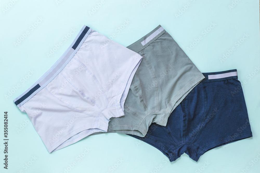 Set of men's underwear on a light background. - obrazy, fototapety, plakaty 