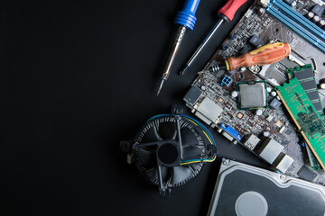personal computer motherboard and computer accessories equipment close up on black background with c