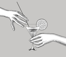 Female Hands Holding A Cocktail With A Orange Slice