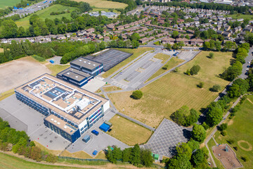 Wall Mural - Aerial drone photo of the Whitcliffe Mount Primary School, showing an aerial photo of the British school building on a bright sunny summers day