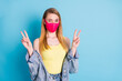 Photo of pretty flirty lady social distancing showing v-sign symbols hands blinking eye handsome guy street wear face mask denim blazer yellow singlet isolated blue color background