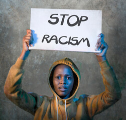 stop racism black activist girl protesting against government - young beautiful and furious afro American woman showing protest banner demanding stop racial discrimination