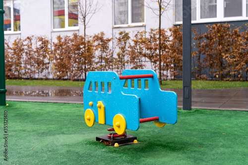 Fotografía Toy car on the playground after rain. Nobody plaing