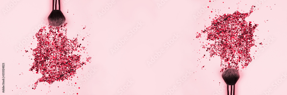 Banner with professional cosmetic makeup brushes with explosion of shiny pink colorful sparkles on pastel pink background with copyspace for your text. Creative make-up concept - obrazy, fototapety, plakaty 