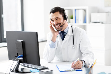 Sticker - healthcare, medicine and technology concept - happy smiling male doctor with headset, computer and clipboard working at hospital