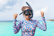 © mikumistock - Asian beautiful woman is snorkeling in the lagoon sea background.