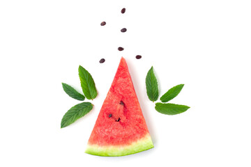 Slice of watermelon with seeds and mint leaves isolated on white background.