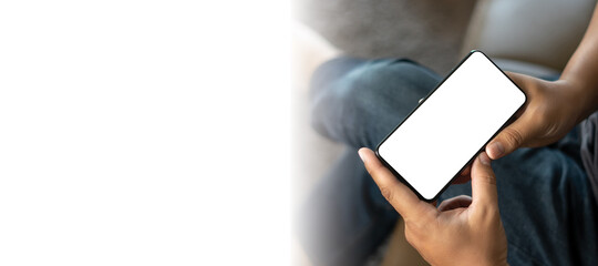 Top view Mockup image hand using a smartphone man Holding Cell Phone With Blank Screen