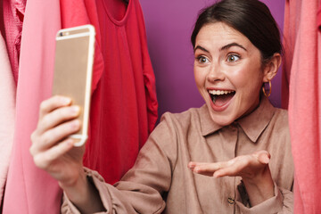 Sticker - Photo of excited woman taking selfie on cellphone and holding copyspace