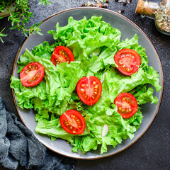 salad vegetables, lettuce and tomato Menu concept. food background top view copy space for text healthy eating keto or paleo diet 