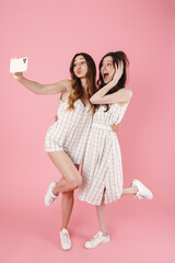 Sticker - Image of women making kiss lips while taking selfie on cellphone